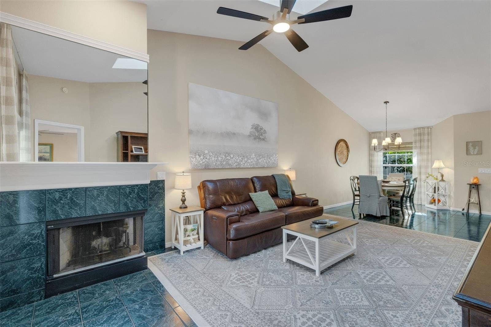 1113 WATERFALL LANE, Lakeland, FL 33803 The wood burning corner fireplace is a nice touch when the weather is mild.