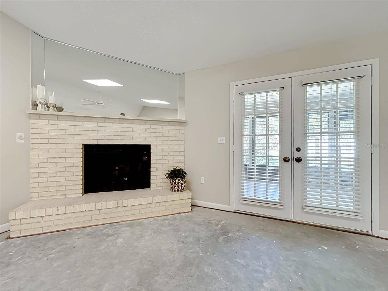 French doors open from great room to enormous Florida room