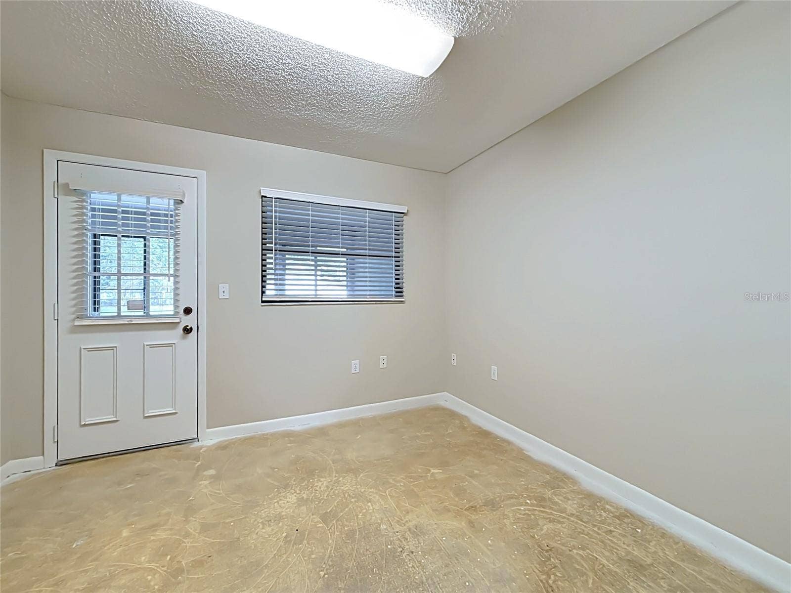Bonus room/office/playroom has door opening to Florida room