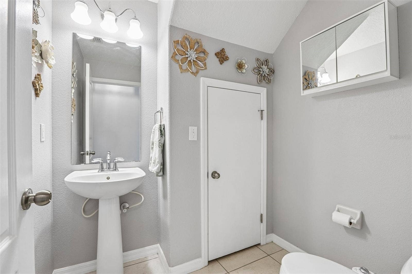 5414 QUARRY ROCK ROAD, #5414, Lakeland, FL 33809 1/2 bath with storage and easy access to the water heater!