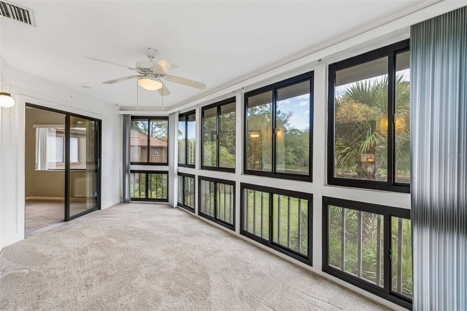 2 SALISBURY COURT, Palm Coast, FL 32137 Enclosed Lanai Under Air overlooking the Water