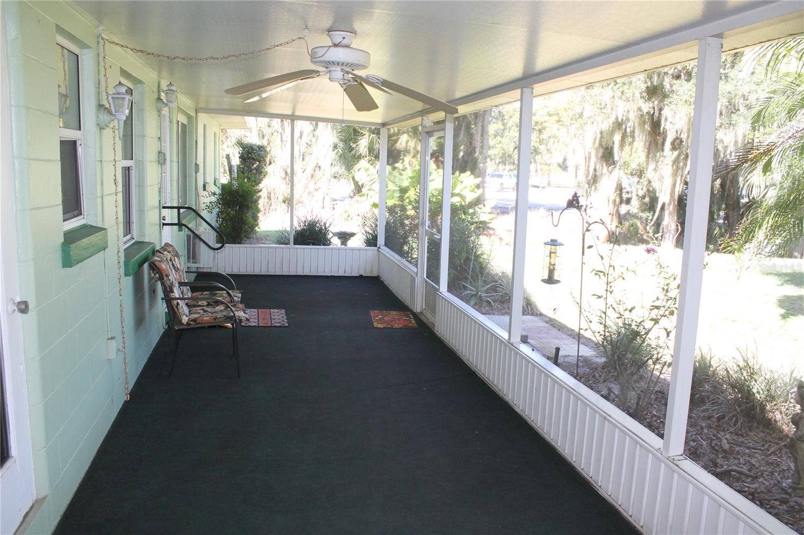 1569 S LAKE SHIPP DRIVE, Winter Haven, FL 33880 Screen porch in the rear of the house overlooking the back yard and Lake