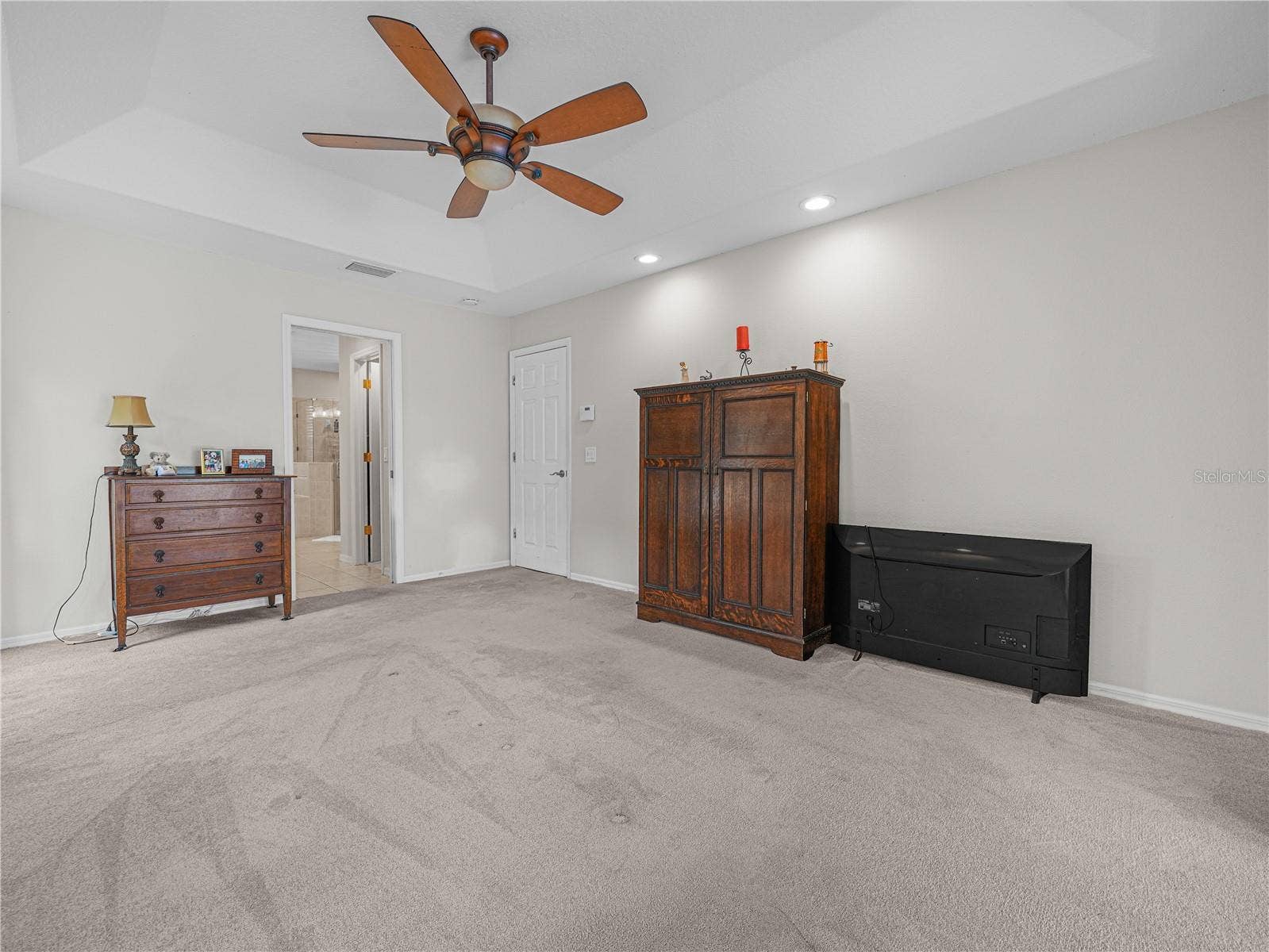 5868 HIGH RIDGE LOOP, Lakeland, FL 33812 Primary bedroom with en suite bathroom and designer ceiling