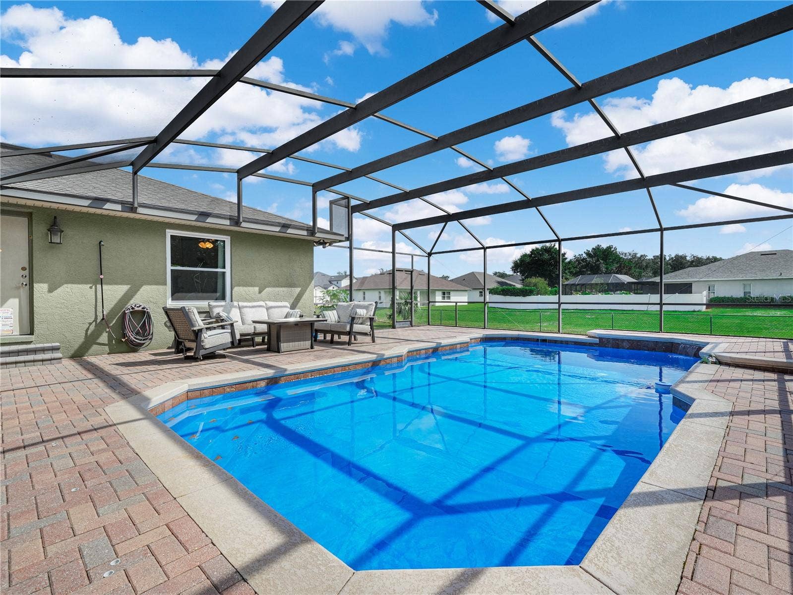 5868 HIGH RIDGE LOOP, Lakeland, FL 33812 The pool with newer screen over looking the large back yard.