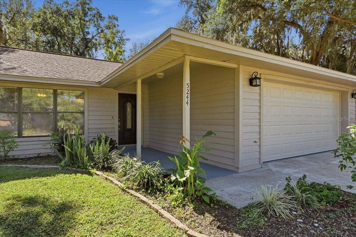 5244 QUIET CREEK LANE, Lakeland, FL 33811 Fresh Exterior Paint in 2026. Nice covered front entry.