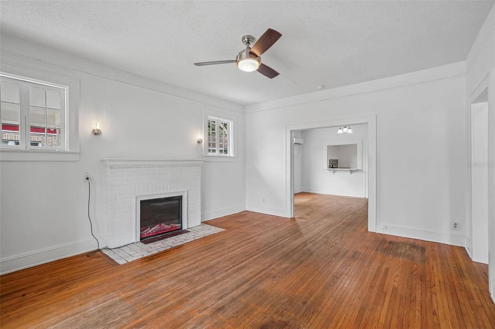 1533 E ELM ROAD, Lakeland, FL 33801 Living Room - Fireplace/Dining Room View