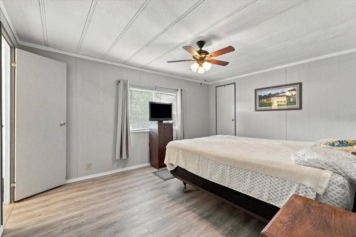 1610 REYNOLDS ROAD, #10, Lakeland, FL 33801 Primary bedroom with walk-in closet