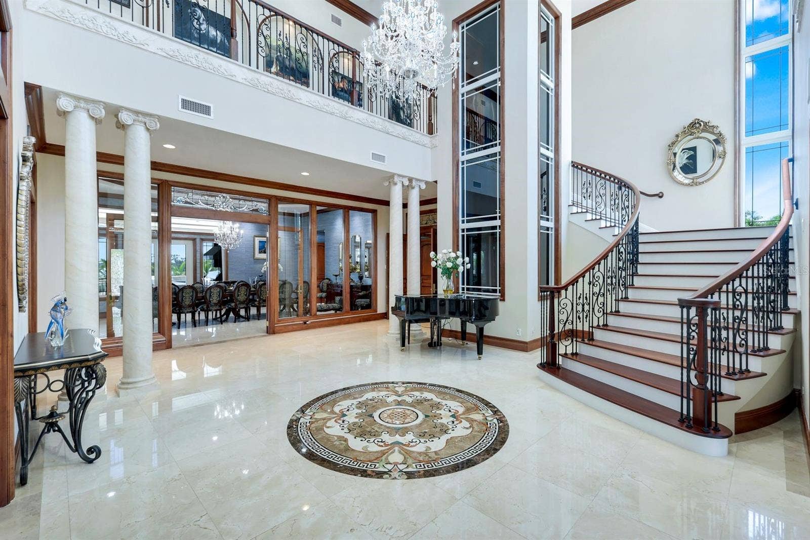 7159 MANASOTA KEY ROAD, Englewood, FL 34223 Foyer with glass elevator and staircase