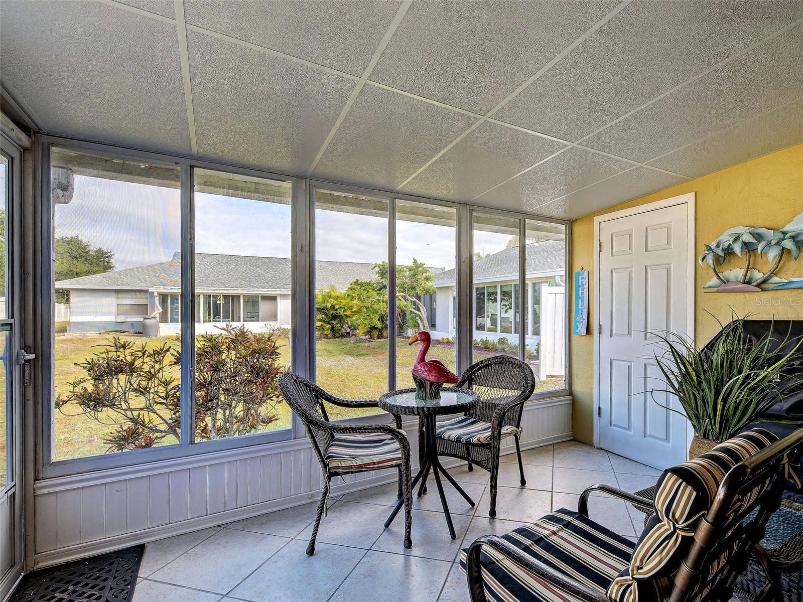lLanai....tiled flooring, enclosed with glass sliding doors/screens. All year use. Storage closet