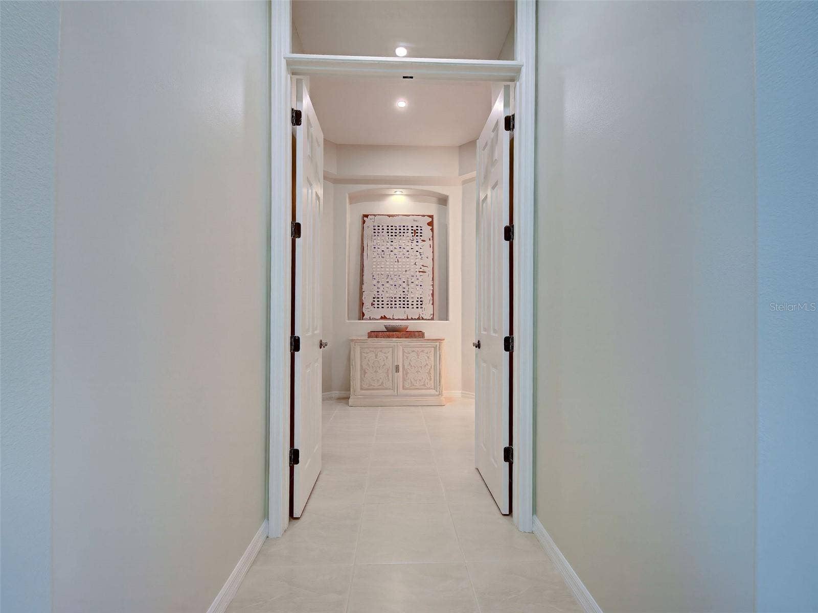 8-foot, double doors for privacy lead to the sumptious primary suite.