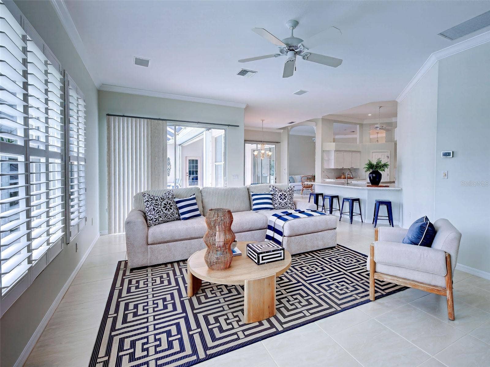 Family room with lanai sliders and easy access to the stunning kitchen.
