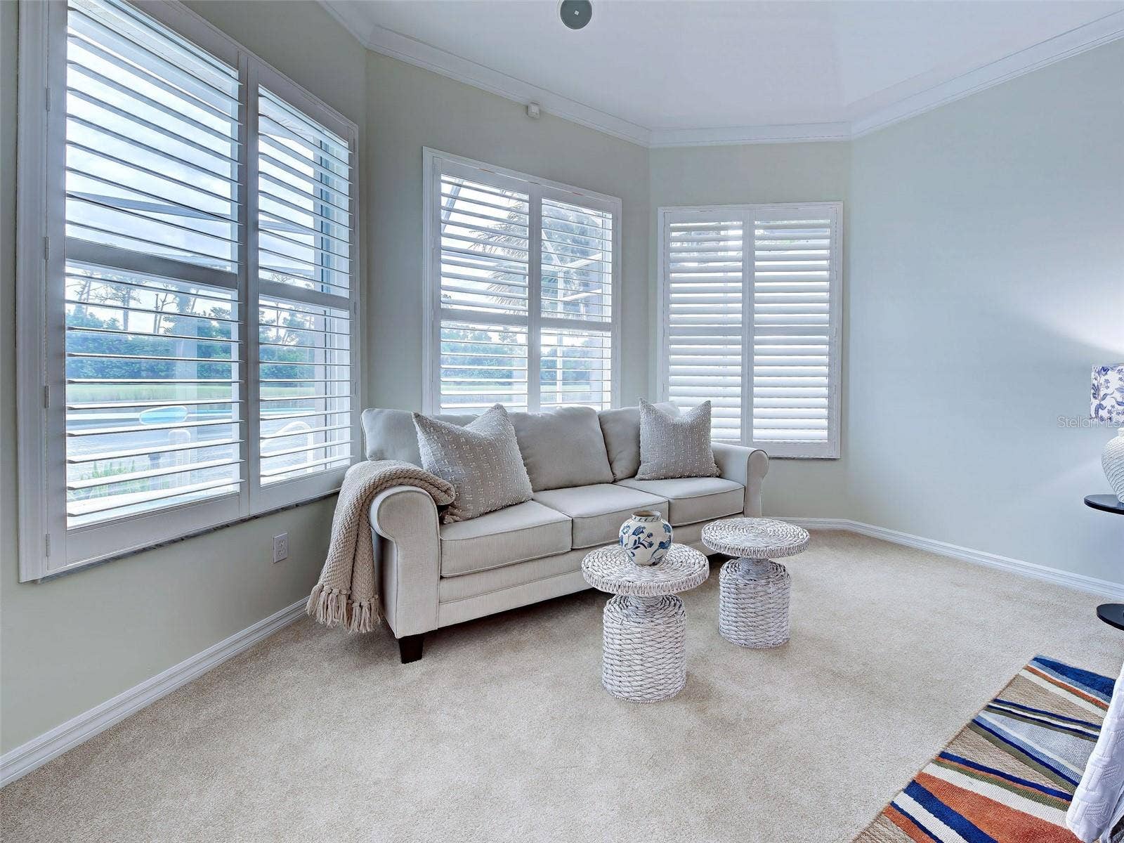Lovely bay window area is just the place to nap or read a good book.