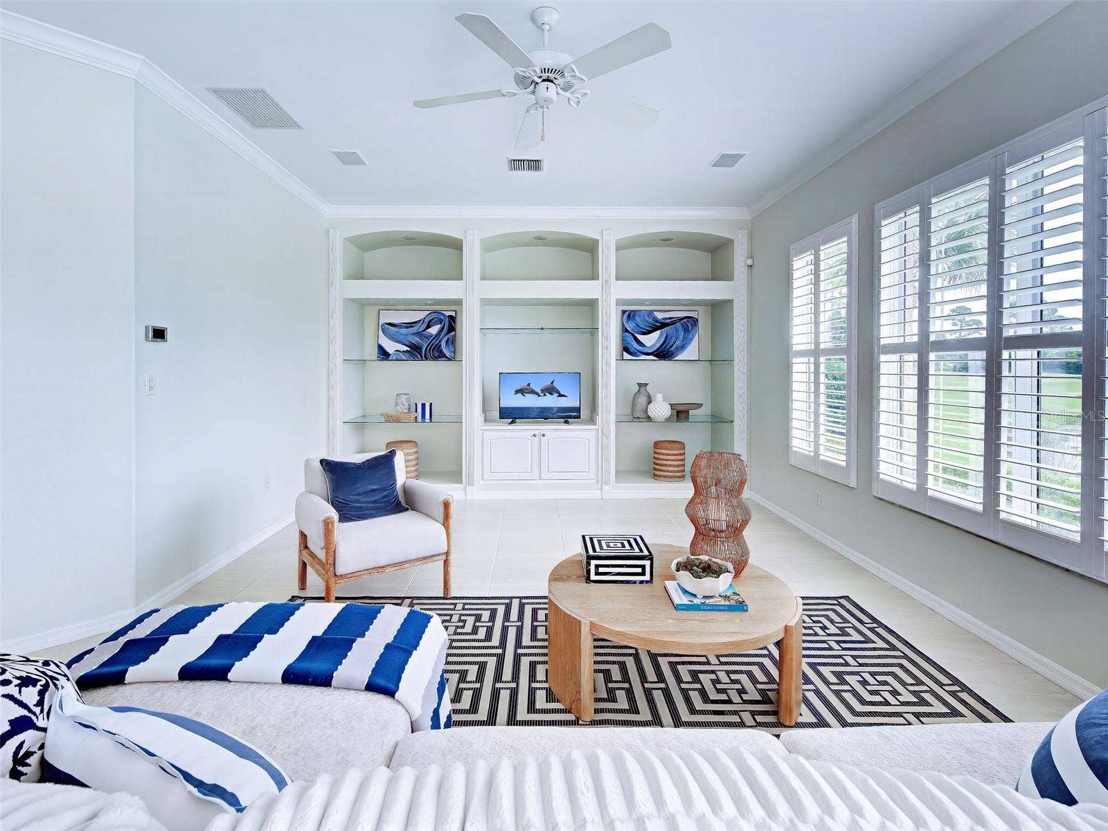 Enjoy a favorite movie or cheer on your team in the large family room with built ins.