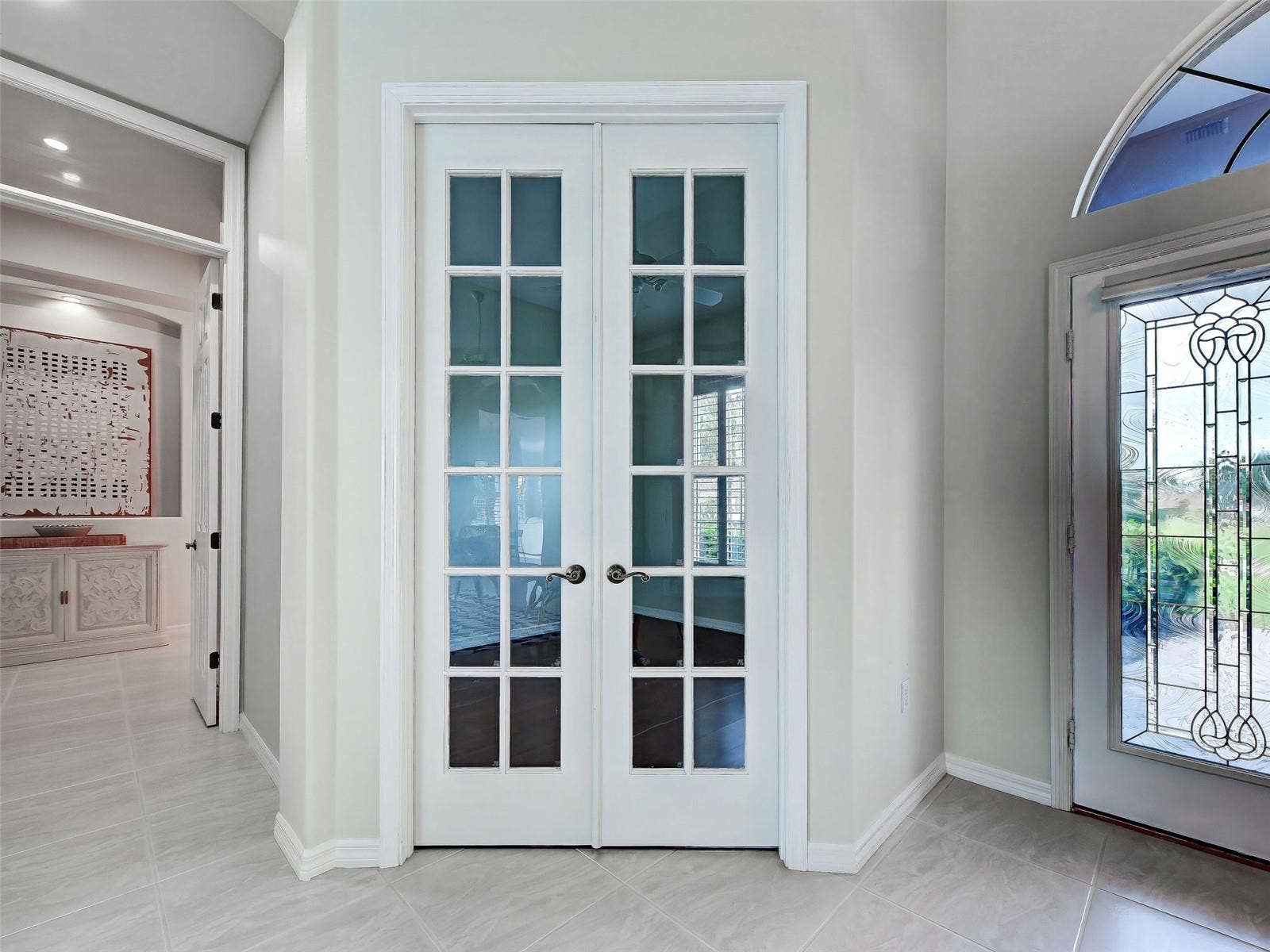 8-foot French doors ensures privacy for the den/office.