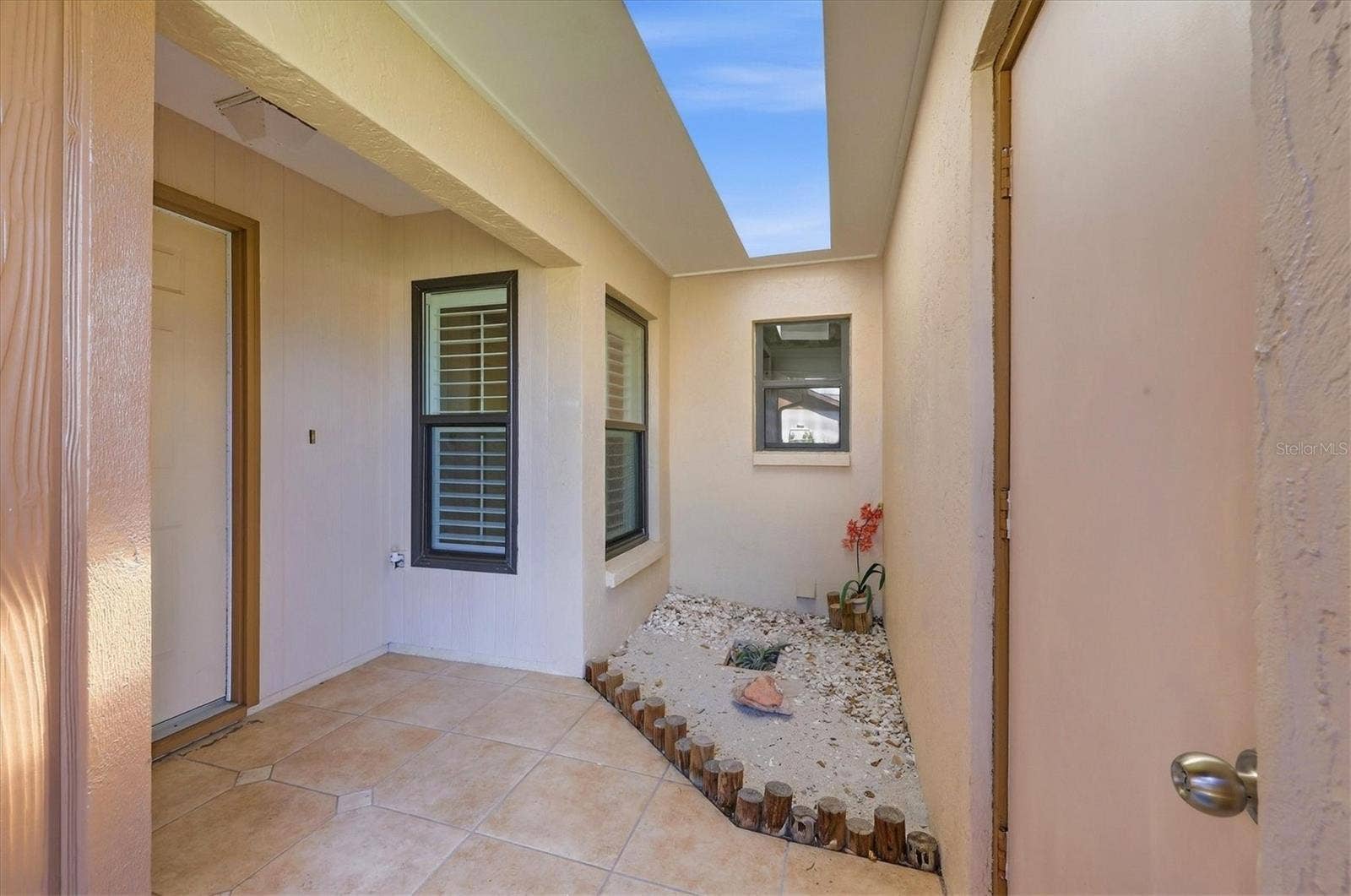 1704 CURRY AVENUE, #39, Nokomis, FL 34275 Entrance between garage door and front door