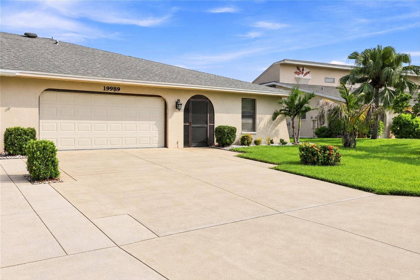 19989 PETRUCKA CIRCLE N, Lehigh Acres, FL 33936 Virtually altered to show clean driveway