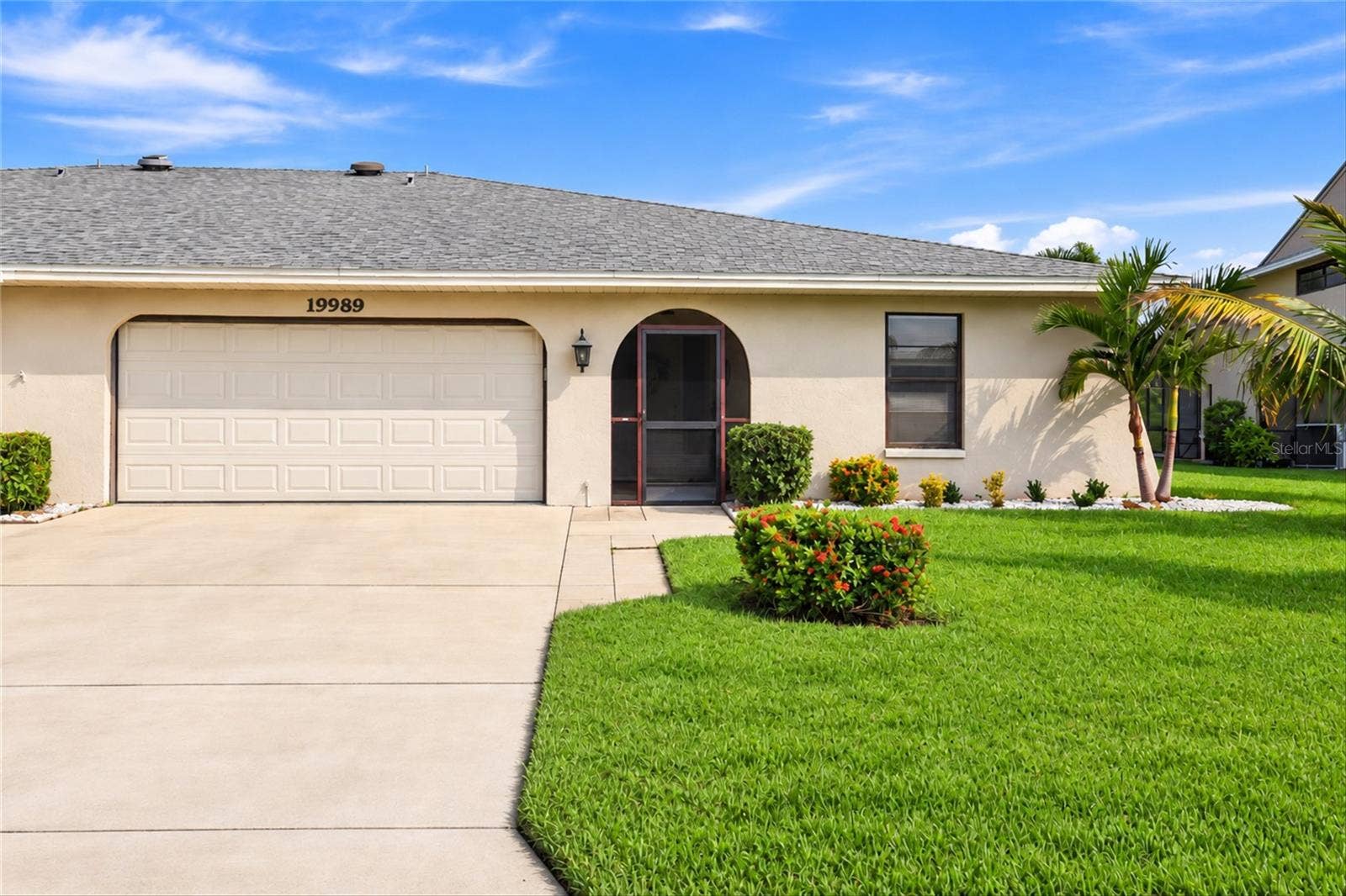 19989 PETRUCKA CIRCLE N, Lehigh Acres, FL 33936 Virtually altered to show clean driveway