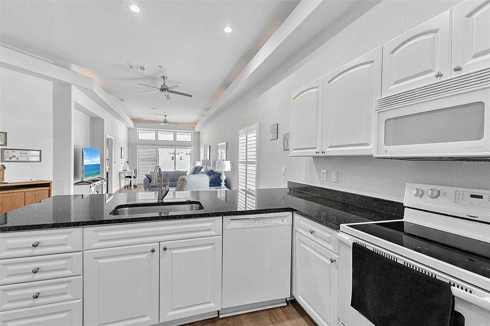 101 NATURES WAY, #1307, Rotonda West, FL 33947 Kitchen looking out to the patio through the great room