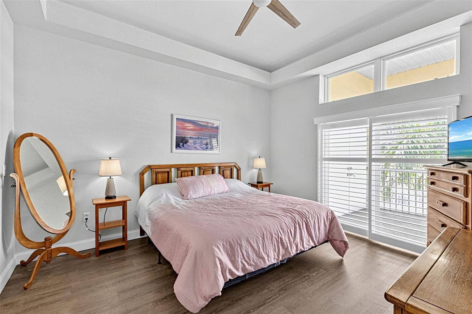 101 NATURES WAY, #1307, Rotonda West, FL 33947 Primary bedroom with slider doors to the enclosed patio