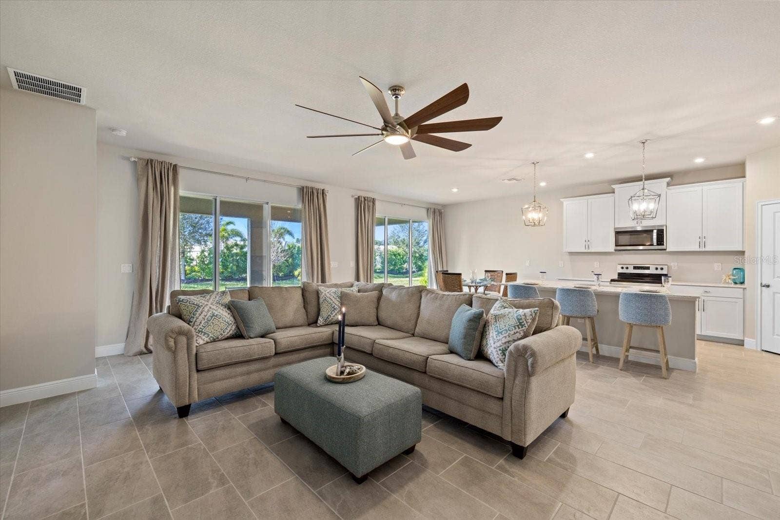 11925 BOHEMIAN PLACE, Venice, FL 34293 Living Room in to Kitchen