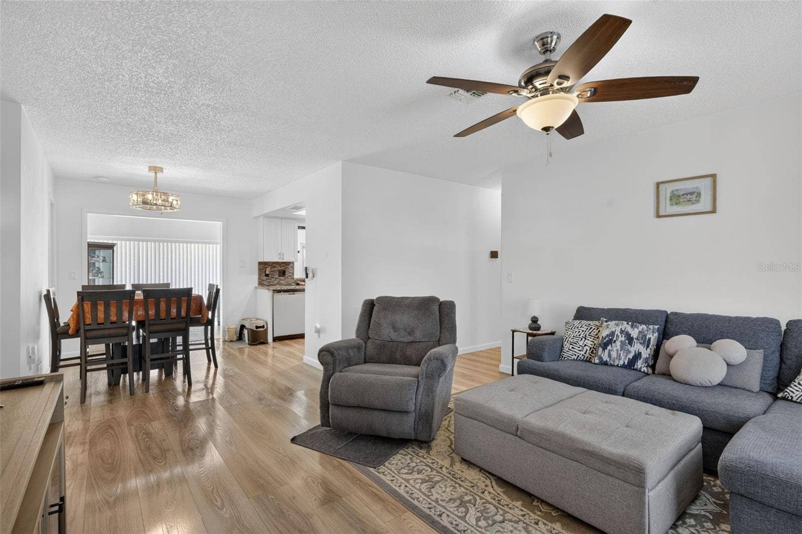 82 CIRCLEWOOD DRIVE, #A3-4, Venice, FL 34293 Living room as you walk in the front door with dining in the far left