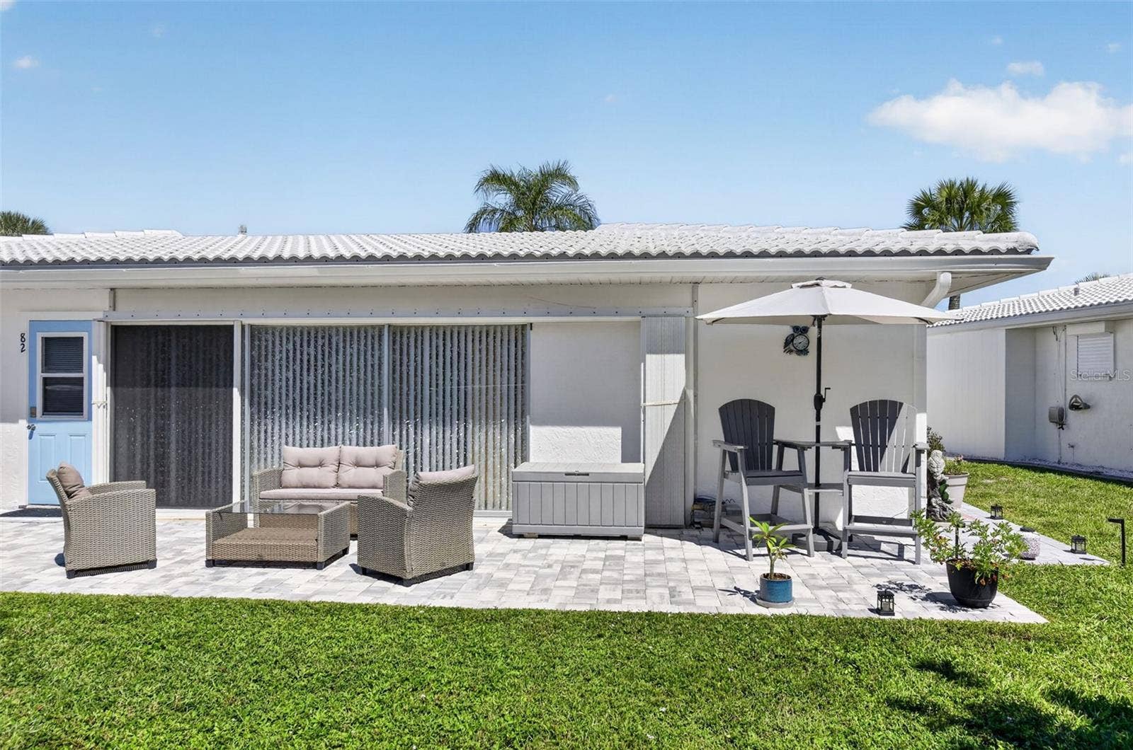 82 CIRCLEWOOD DRIVE, #A3-4, Venice, FL 34293 Outdoor patio with pavers installed 2025