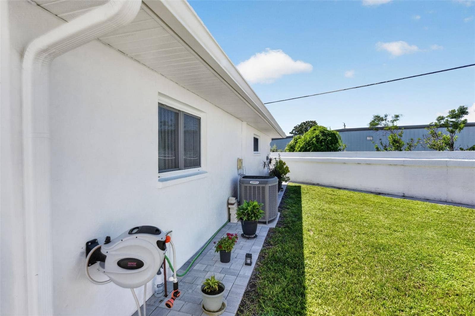 82 CIRCLEWOOD DRIVE, #A3-4, Venice, FL 34293 Side of home pavers installed 2026