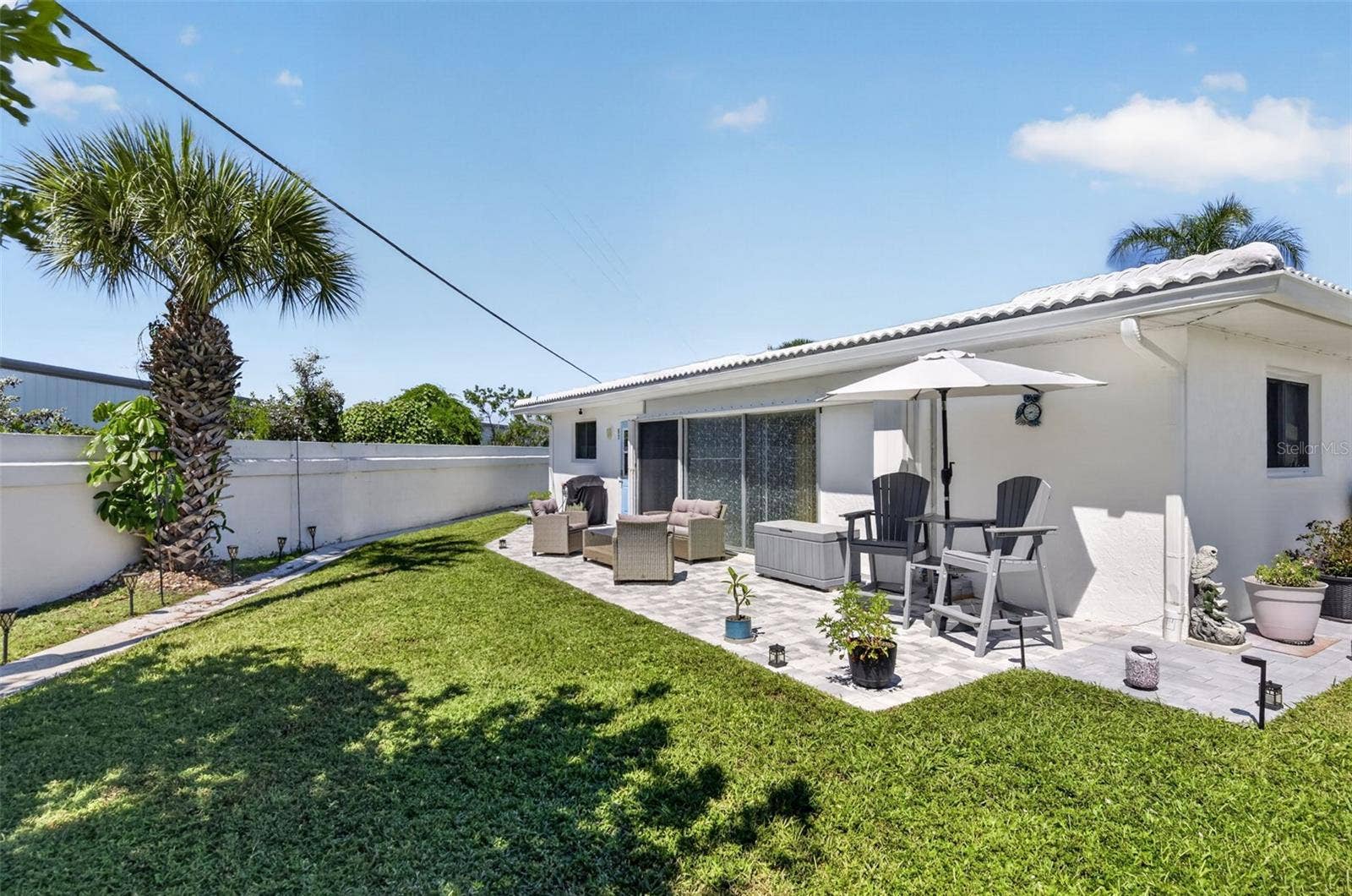 82 CIRCLEWOOD DRIVE, #A3-4, Venice, FL 34293 backyard and patio view