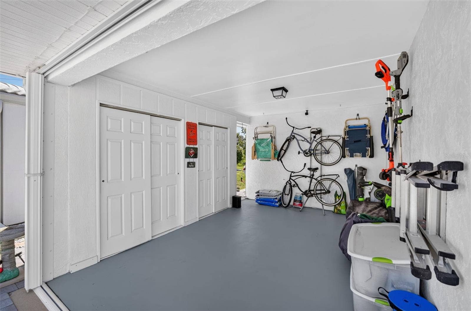 82 CIRCLEWOOD DRIVE, #A3-4, Venice, FL 34293 Carport with storage closets