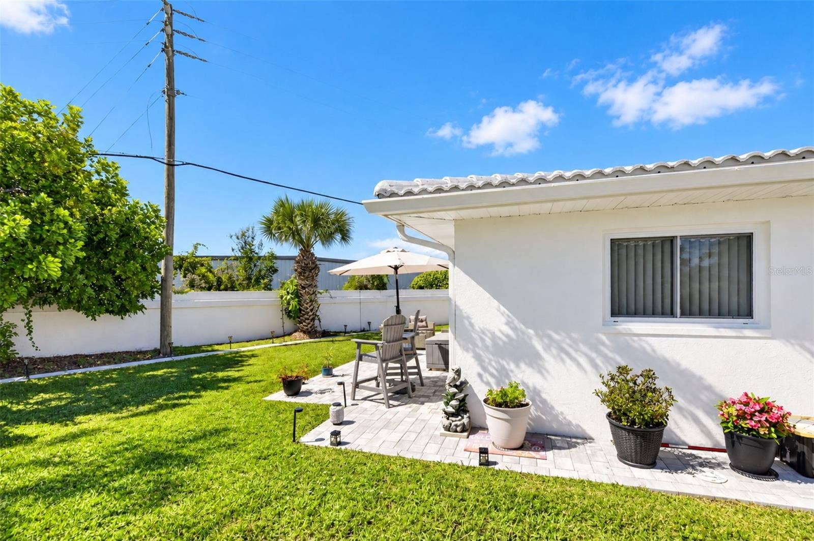 82 CIRCLEWOOD DRIVE, #A3-4, Venice, FL 34293 Side of home with pavers installed 2026