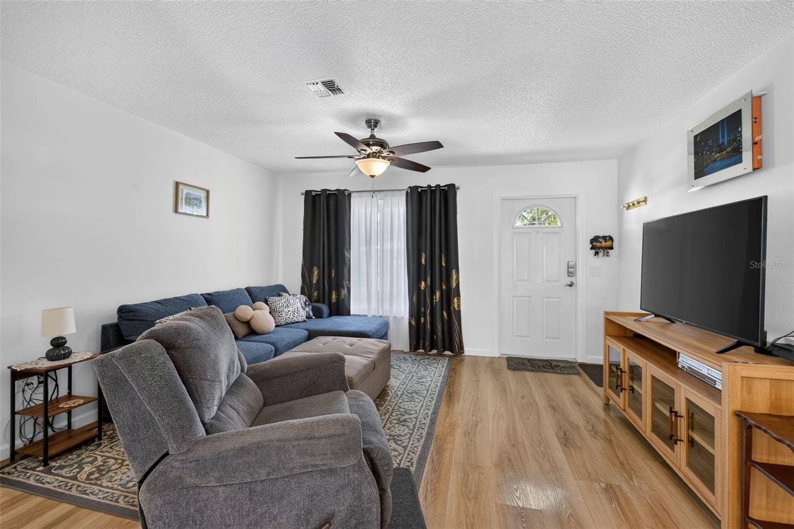 82 CIRCLEWOOD DRIVE, #A3-4, Venice, FL 34293 View of living room from dining area