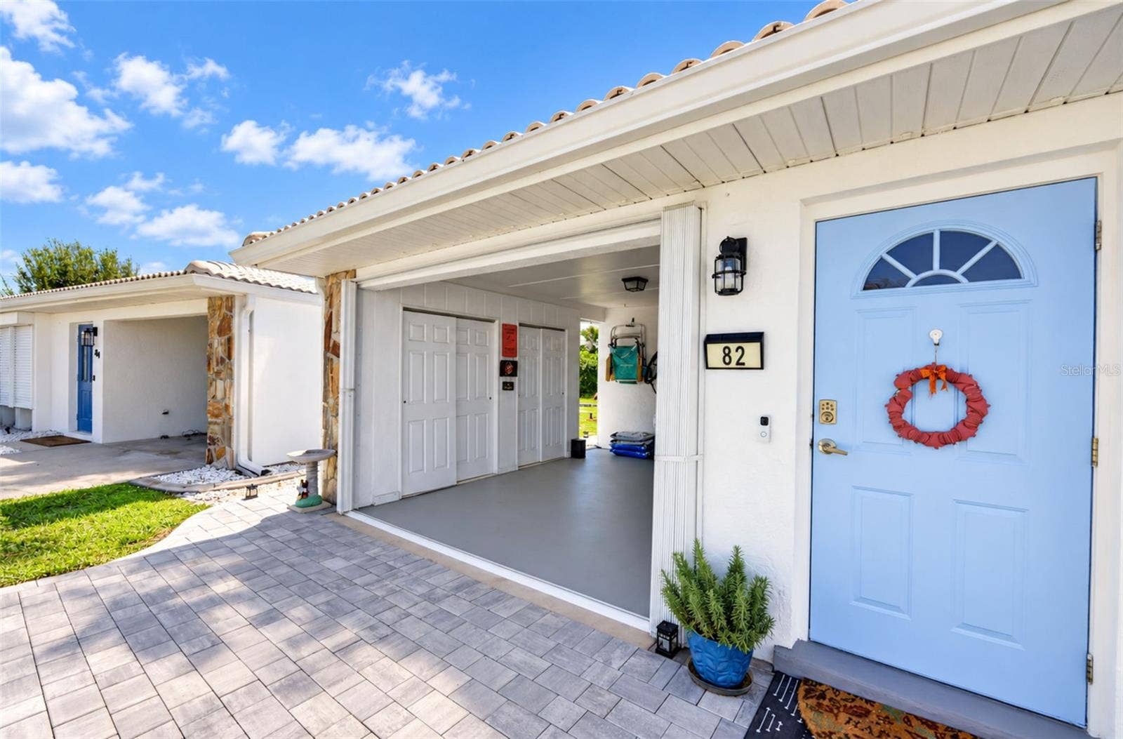 82 CIRCLEWOOD DRIVE, #A3-4, Venice, FL 34293 Front entryway and carport