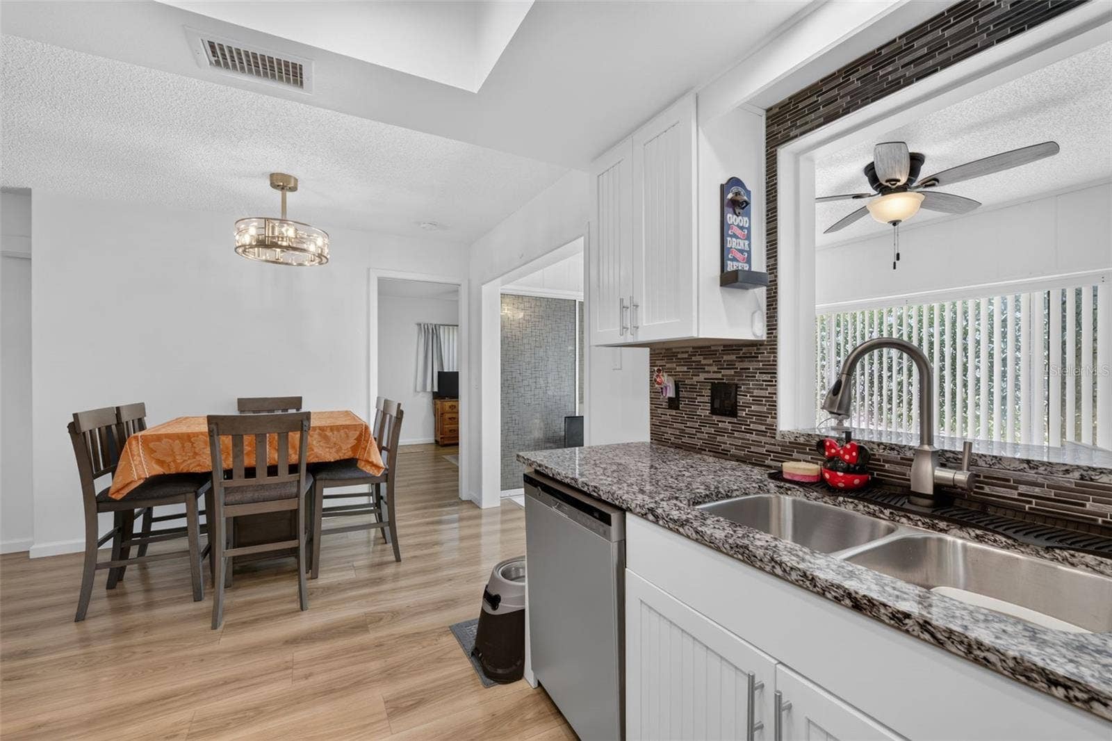 82 CIRCLEWOOD DRIVE, #A3-4, Venice, FL 34293 View from kitchen to dining area