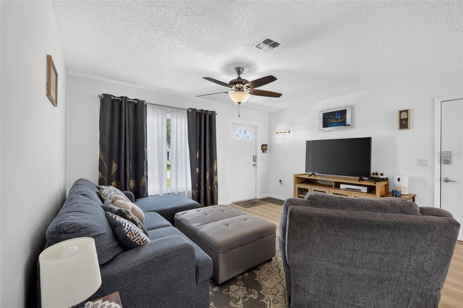 82 CIRCLEWOOD DRIVE, #A3-4, Venice, FL 34293 View of living room from hallway