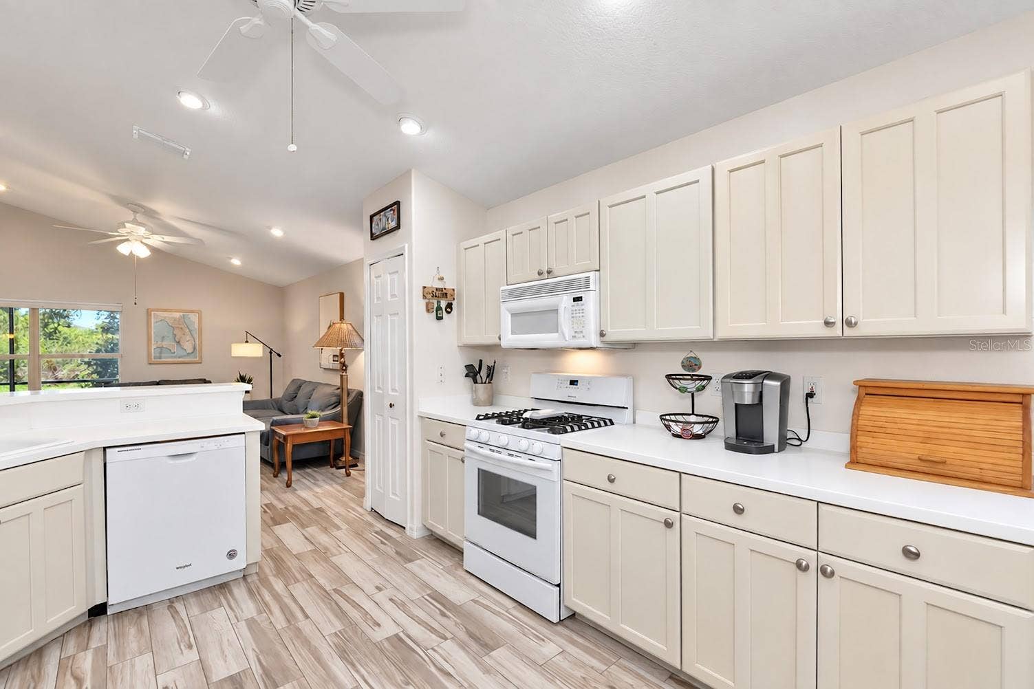 5113 FLAGSTONE DRIVE, Sarasota, FL 34238 Natural gas range, hood microwave vents outside.