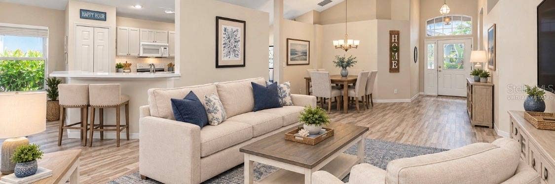 5113 FLAGSTONE DRIVE, Sarasota, FL 34238 Virtually Staged Combined living and dining room.