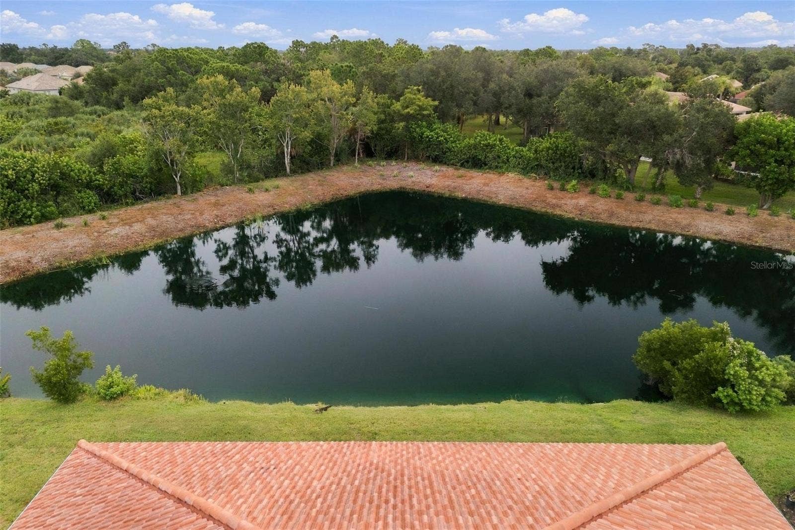10828 LERWICK CIRCLE, Englewood, FL 34223 Southeastern facing pond view