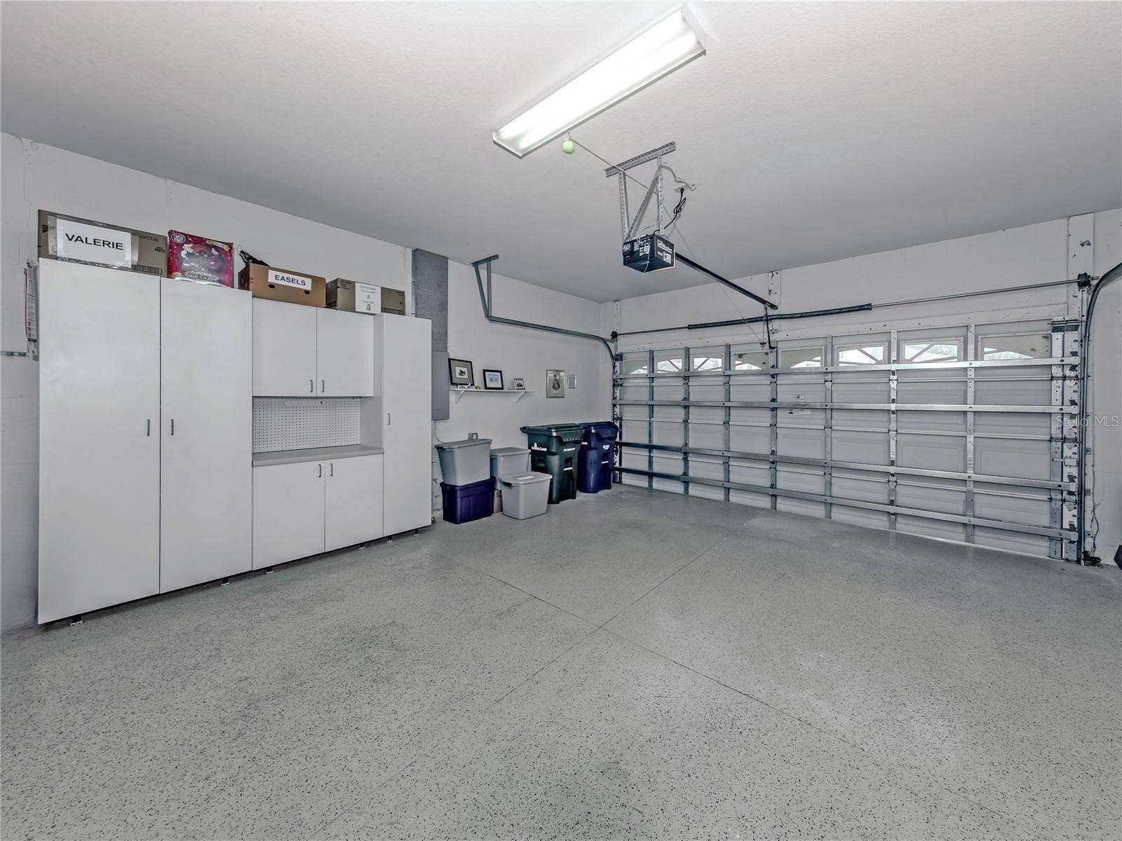 20684 CAPELLO DRIVE, Venice, FL 34292 Large size Gararge with storage cabinets and trek flooring