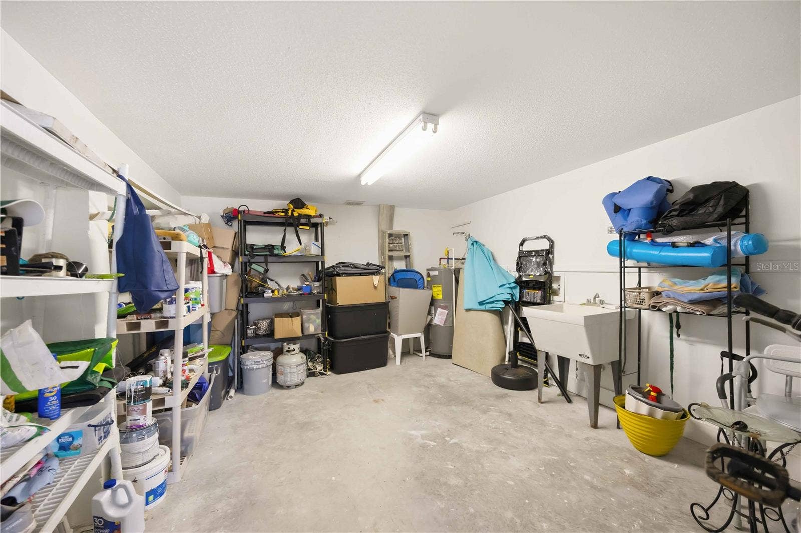 4260 PLACIDA ROAD, #17A, Englewood, FL 34224 large storage room inside carport / electrical and plumbing