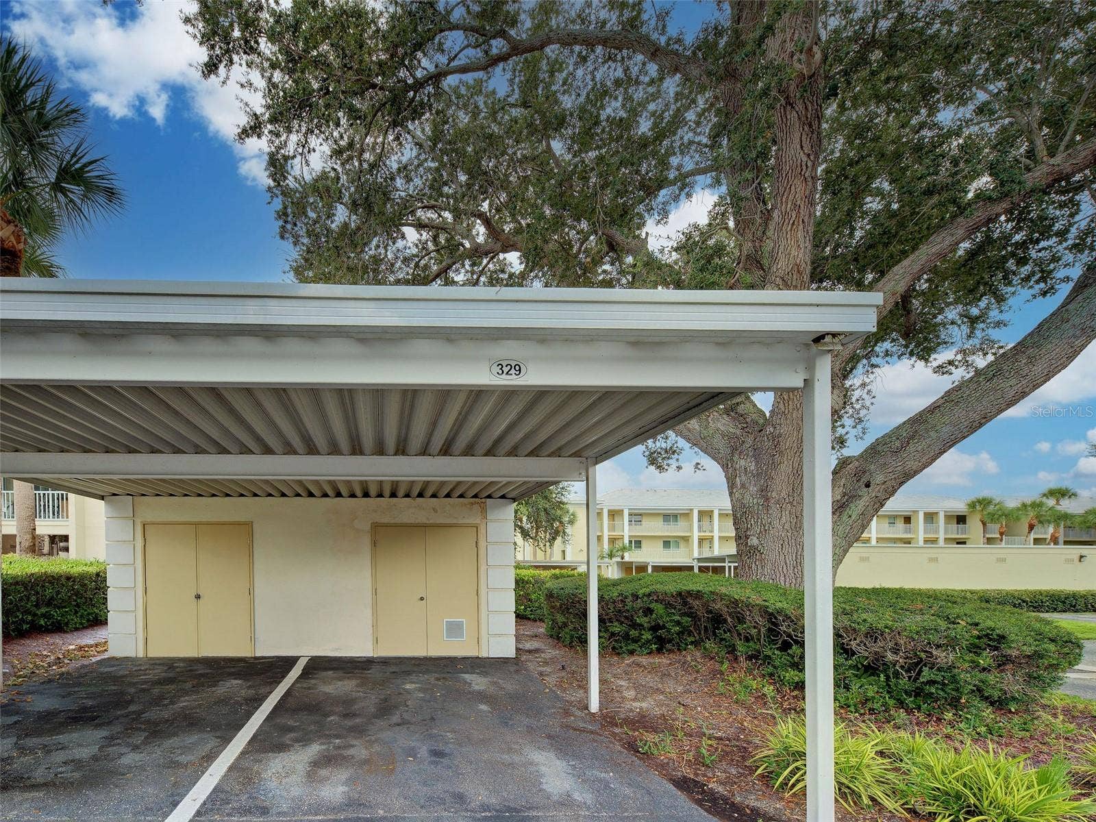Carport parking spot with storage.