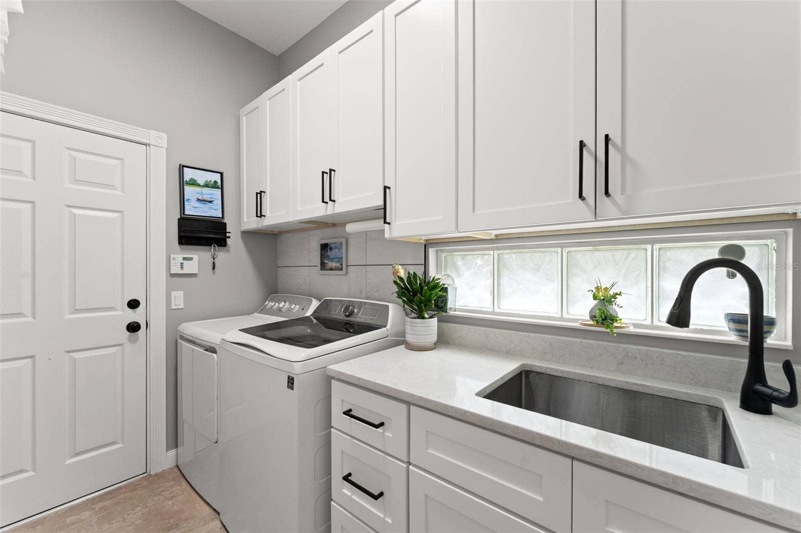 13150 GUYANA STREET, Venice, FL 34293 Laundry room with utility sink