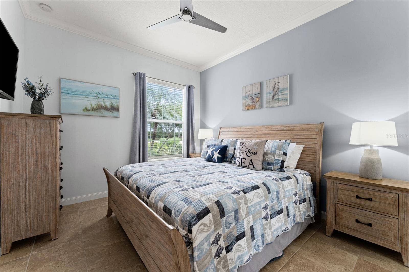 13150 GUYANA STREET, Venice, FL 34293 Guest bedroom with crown molding and tile flooring