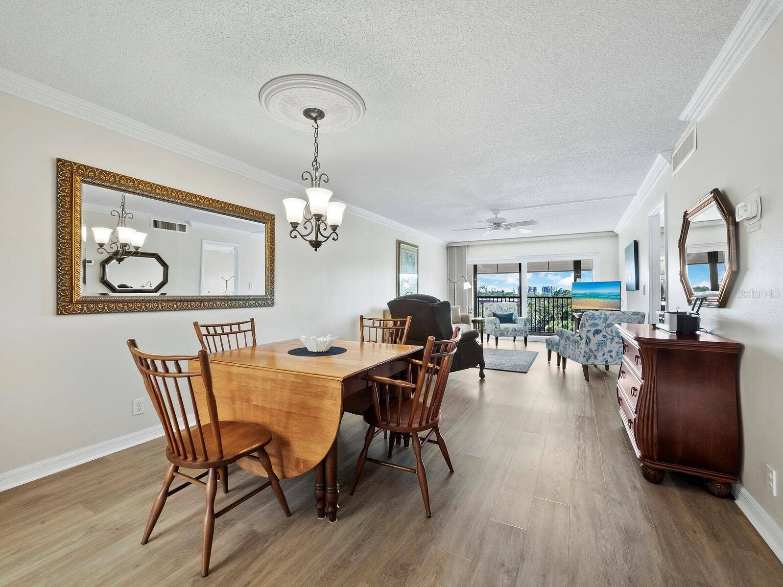 512 W VENICE AVENUE, #607, Venice, FL 34285 Combined dining and living room leading to the lanai