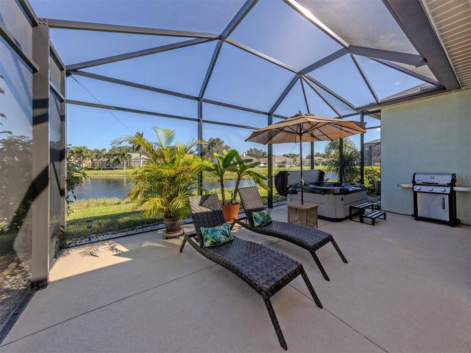 This is what Florida living is all about! Imagine leisurely mornings, breezy afternoons, and picture-perfect evenings on your gorgeous extended lanai, where the shimmering lake creates a breathtaking backdrop! Spacious, screened, and surrounded by natural beauty, it's an irresistible spot to kick back, entertain, and savor every beautiful moment!