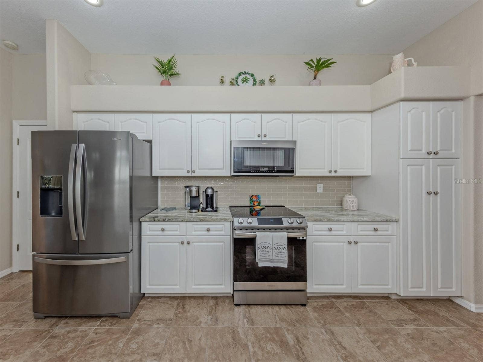 Everything has its place in this thoughtfully designed kitchen! Enjoy stainless steel appliances, a versatile convection microwave, and a pantry with convenient pull-out drawers and upper shelving that makes storage and organization a breeze!