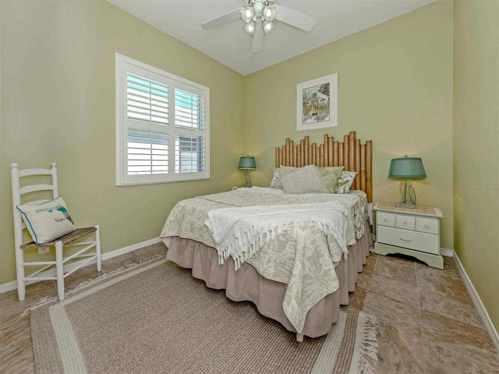 Sweet dreams start here! This lovely guest bedroom is filled with warmth and charm, creating a welcoming haven where family and friends can settle in, feel right at home, and enjoy a little getaway of their own!