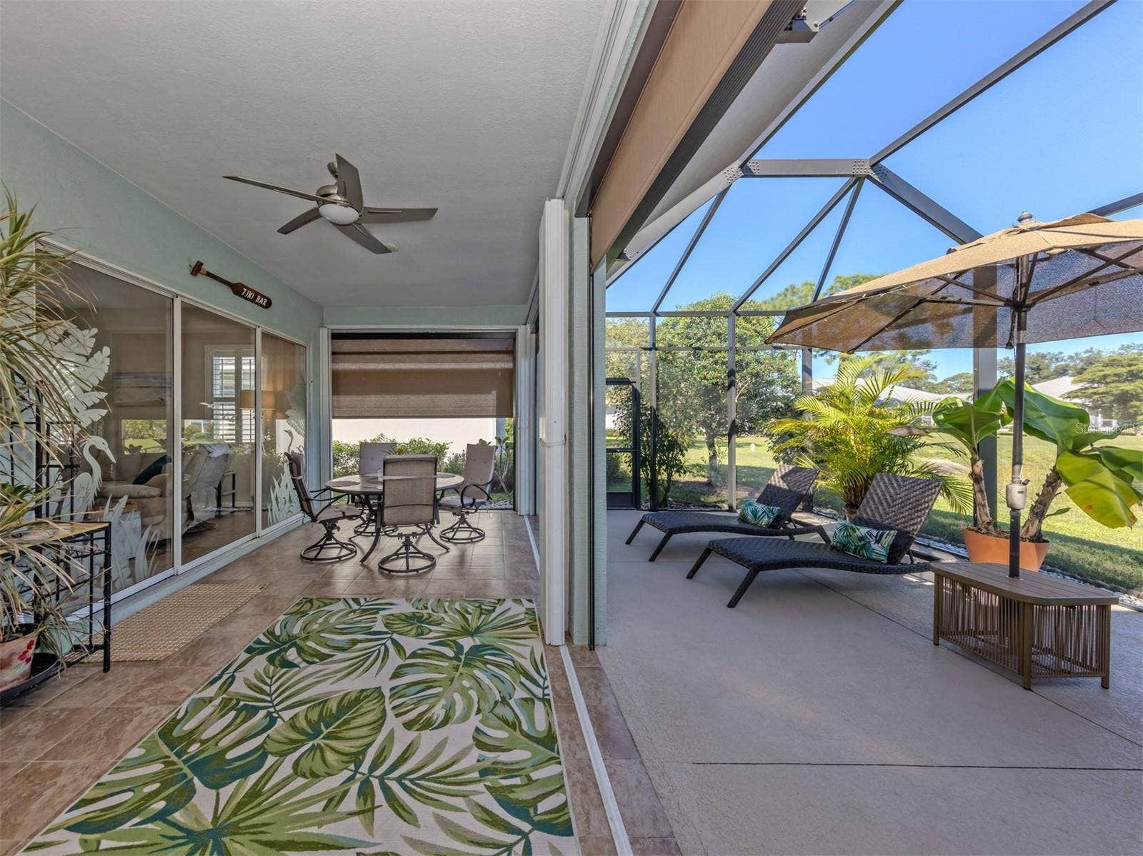 Your favorite room might just be outdoors! Enjoy dinner beneath the covered lanai, then wander into the spacious screened extension to catch the breeze. With the touch of a button, electric shades adjust to your liking, while already-installed hurricane shutters slide shut when needed. It's outdoor living made wonderfully easy!
