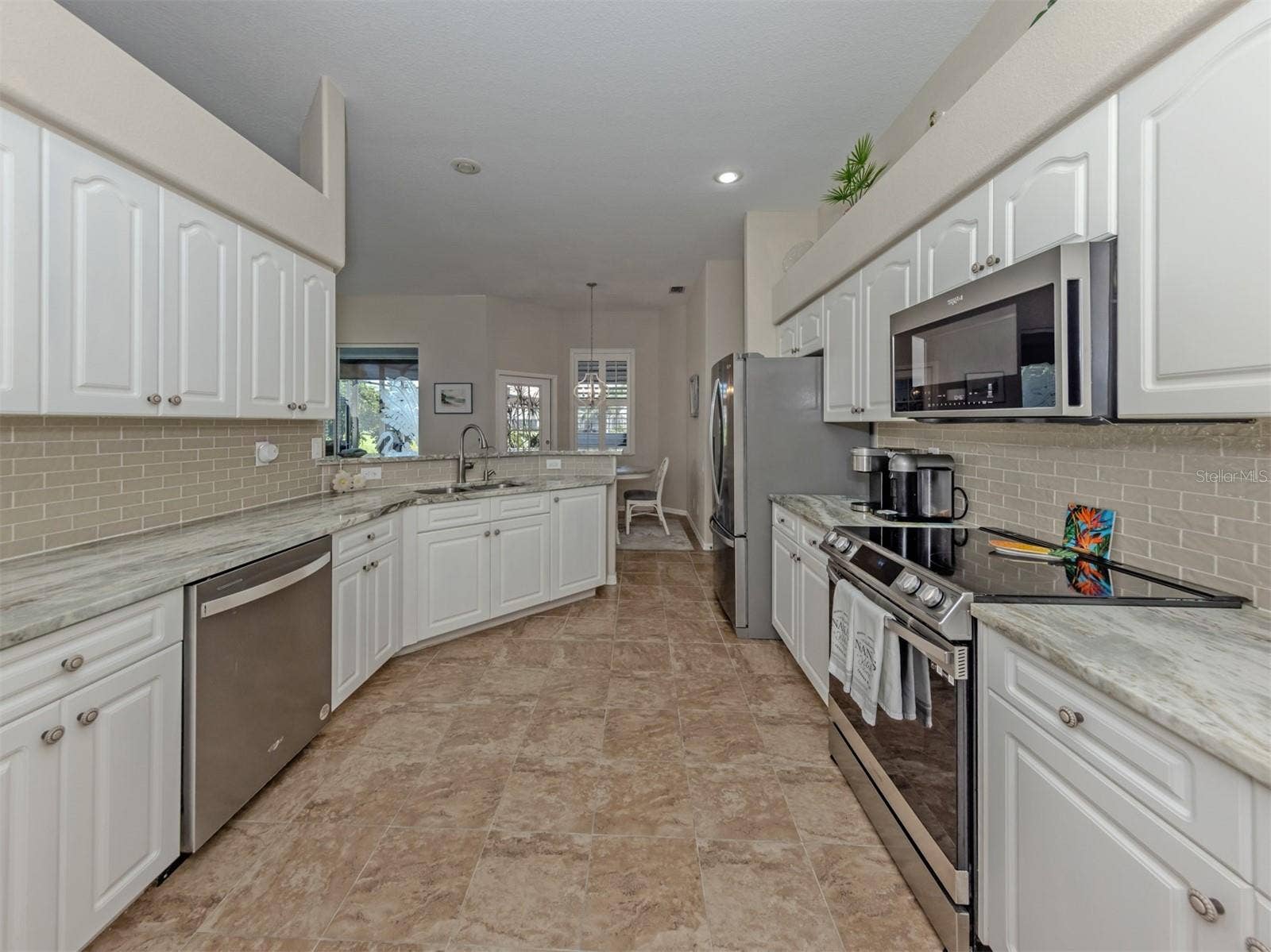 Where style meets everyday convenience! This thoughtfully designed kitchen offers generous counter space, an inviting layout, and all the little touches that make cooking and entertaining a pleasure!
