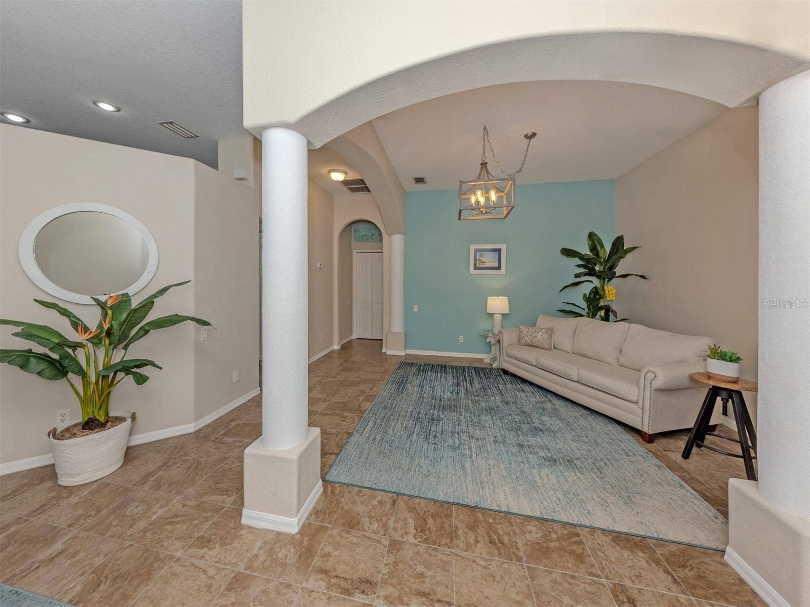 Another inviting view of this charming, versatile space, where soft lighting and a cozy atmosphere create the perfect little retreat to relax, enjoy a good book, or gather for conversation!