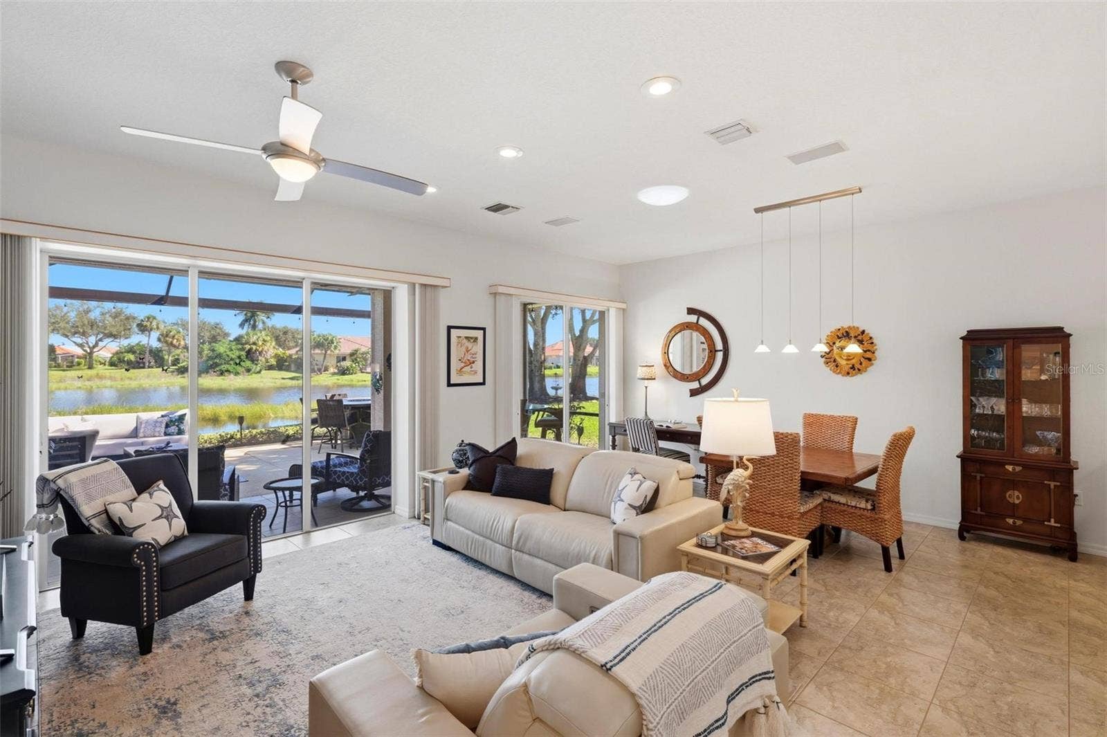 687 LAKESCENE DRIVE, Venice, FL 34293 Living room/dining room with water views